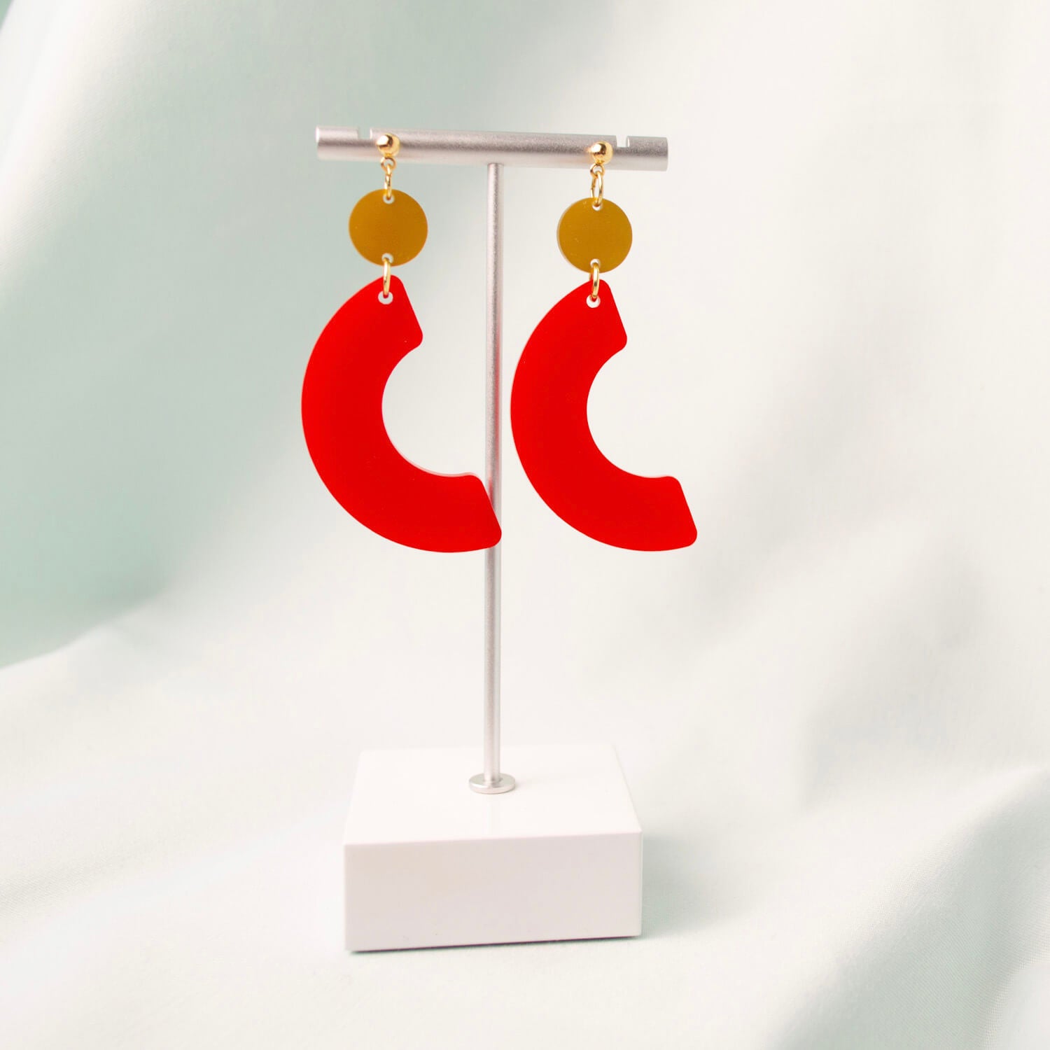 Laser cut satin solid red and satin solid gold plexiglass earrings